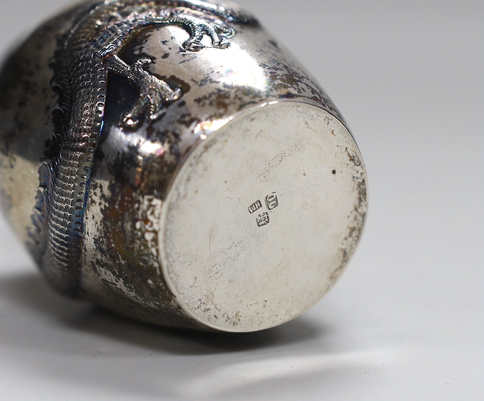 A late 19th/early 20th century Chinese Export white metal sugar sifter, by Wang Hing, Hong Kong, decorated with a dragon, height 10.2cm, 5.2oz.